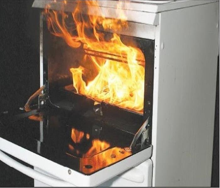 White oven with flames from a fire