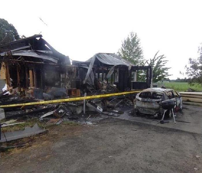 house and vehicle burnt